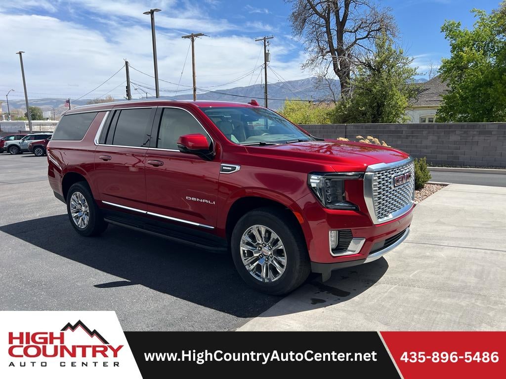 2024 GMC Yukon XL Denali in Volcanic Red Tintcoat — front three-quarter view